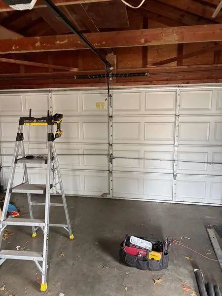 Garage door spring system repair St. Louis MO - extension torsion springs